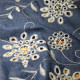 Tissu jean's brodé Fleurs ajouré Bleu
