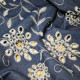 Tissu jean's brodé Fleurs ajouré Bleu